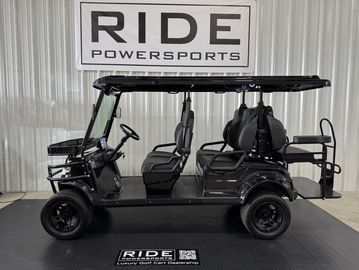 A black luxury golf cart with four seats and a roof.