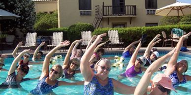 Group Water Therapy and Water Aerobics Class Stretching after a great workout