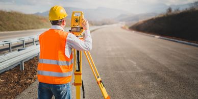 Surveyor on highway