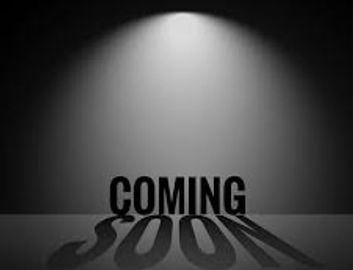 Black and white 'Coming Soon' text with dramatic lighting and shadow.