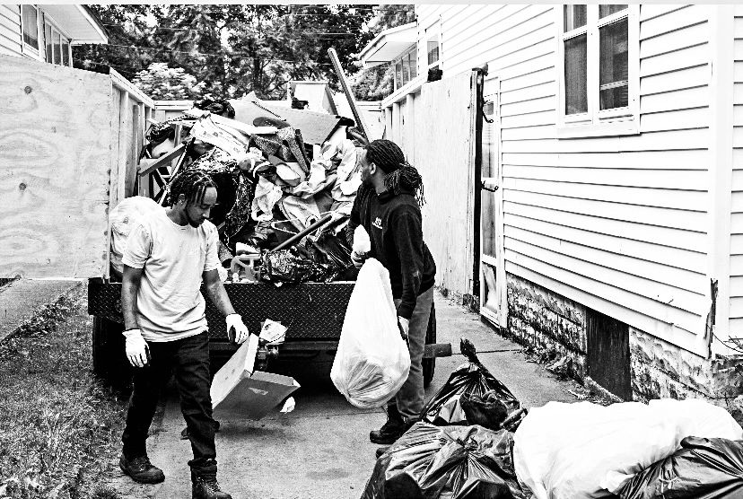 RTS Rocks Trash Service crew removing bags and unwanted items during a residential property cleanout