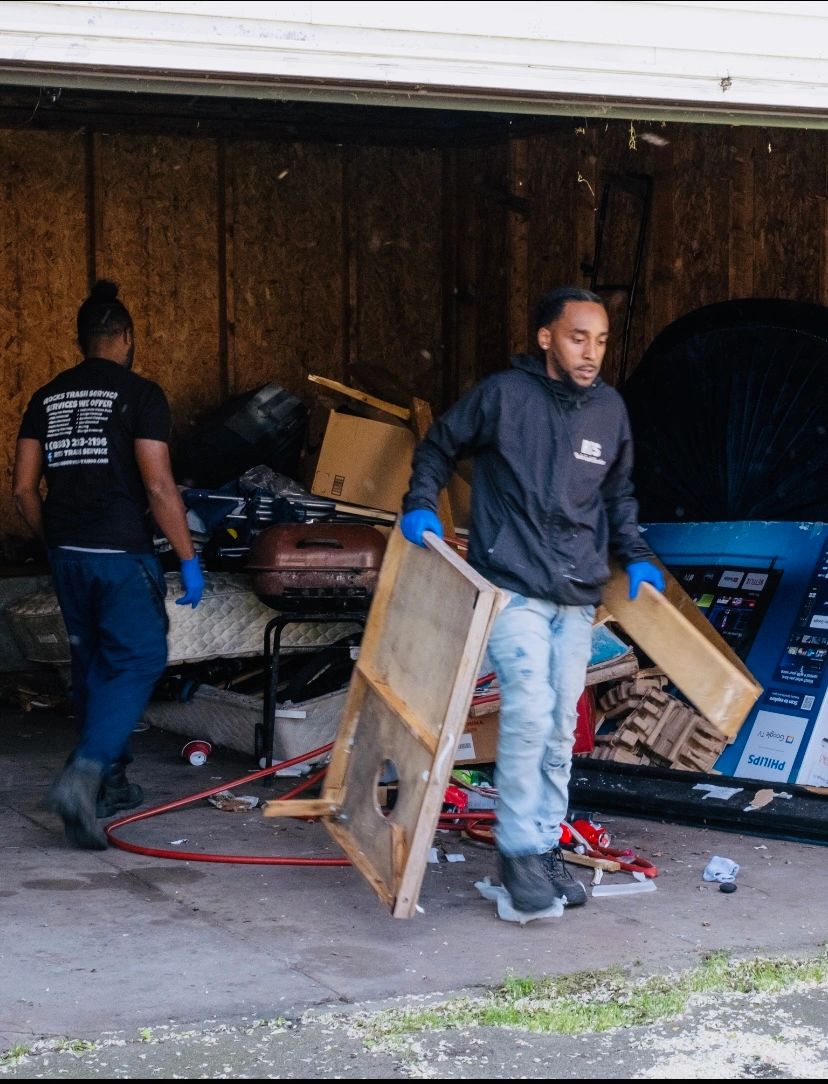 RTS Rocks Trash Service crew removing furniture and unwanted items during a garage cleanout 