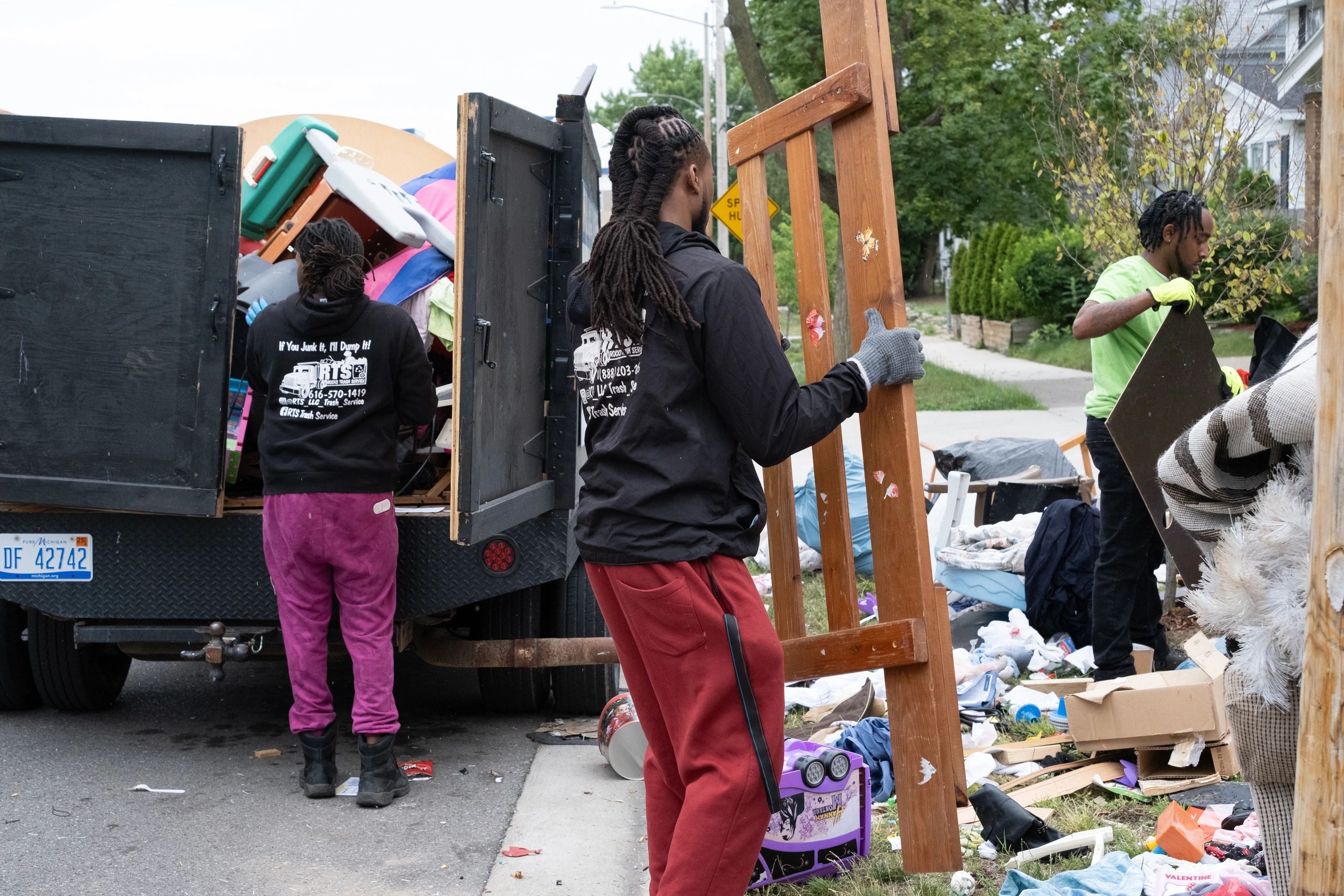 RTS Rocks Trash Service crew loading furniture and household junk into the company truck during a We