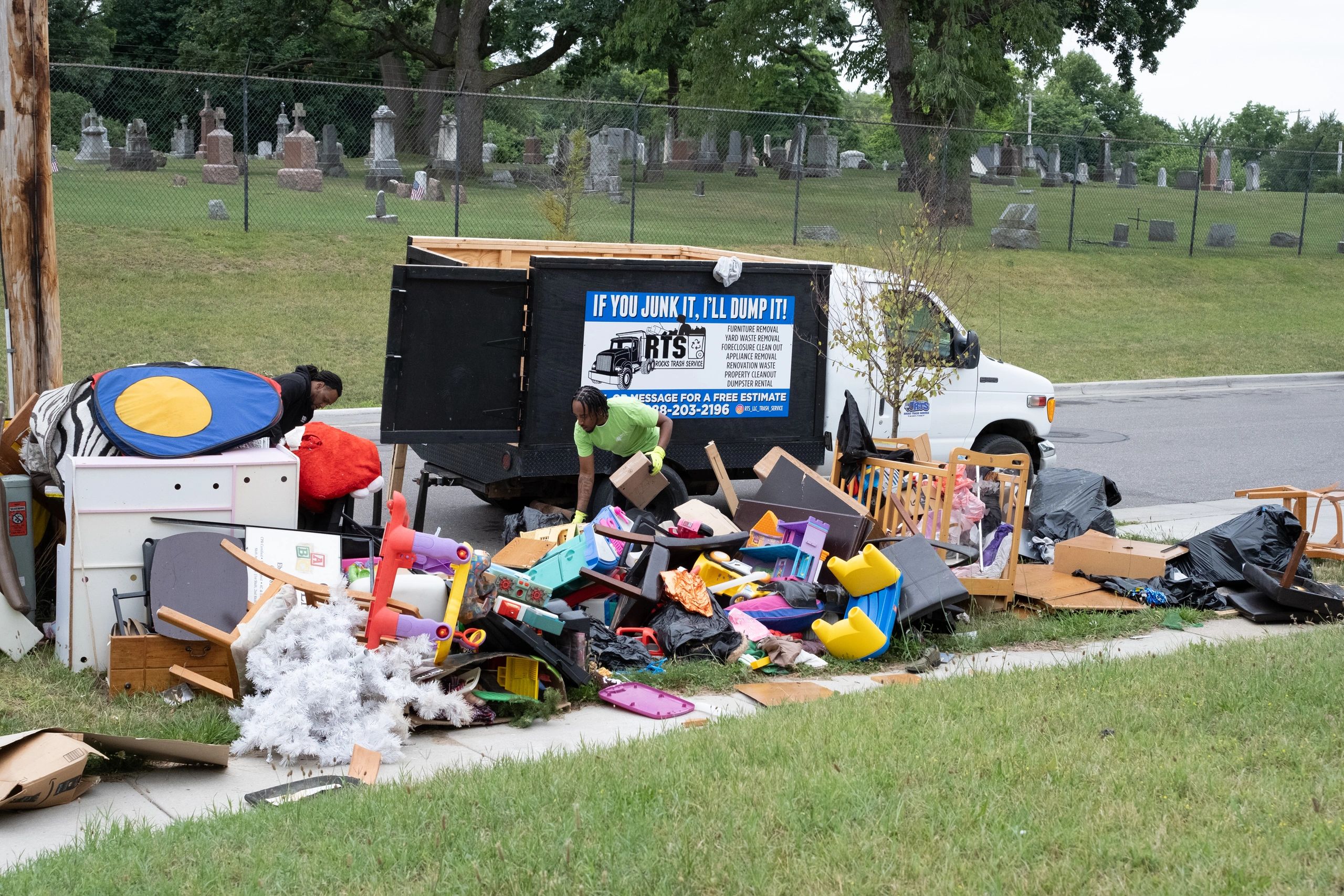 RTS Rocks Trash Service truck and crew completing a large curbside junk removal job in West Michigan