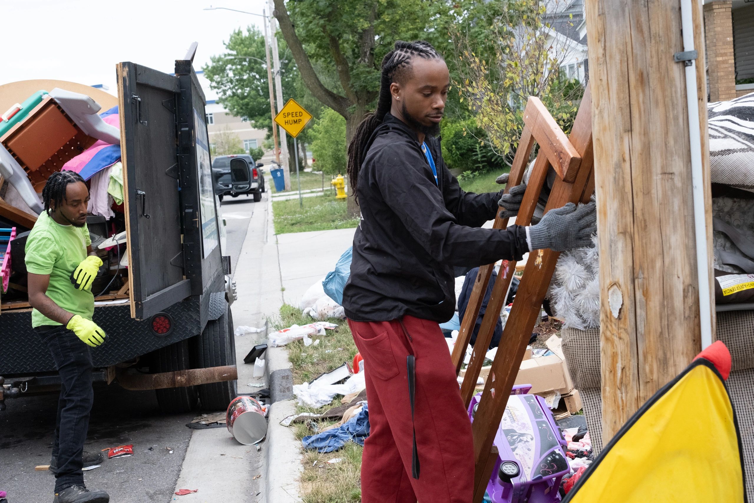 RTS Rocks Trash Service crew removing large furniture and unwanted items during a residential cleano