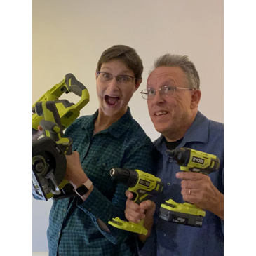 Photo ⚙ of Mark & Sharon enthusiastically holding battery operated tools