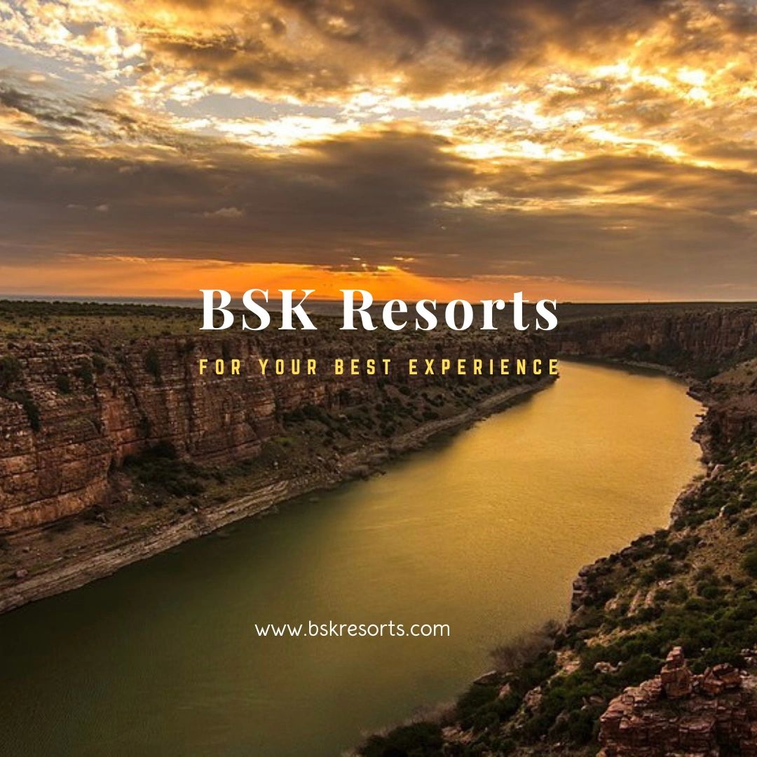 Sunset view over a river canyon promoting BSK Resorts for a memorable experience.