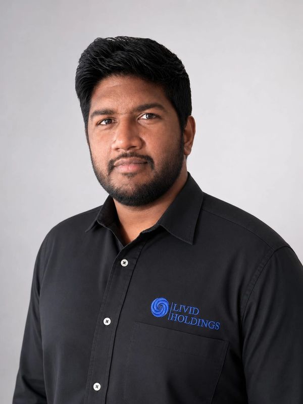 Professional man wearing a black shirt with Livid Holdings logo.