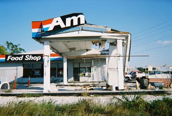 Closed and damaged Former Amoco building.
