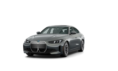 Sleek gray BMW with distinctive large kidney grille on black background.