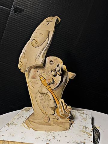 Abstract sculpture featuring a skeletal figure playing a stringed instrument.