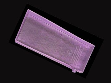 Purple-tinted rectangular object on black background.