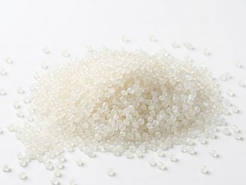 Small white plastic pellets piled together.