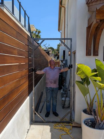 Custom steel gate frame welded and installed. 