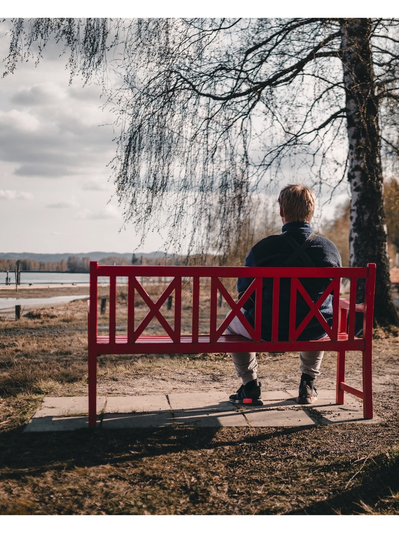 Man sitting on a bench thinking about starting therapy in Colorado Springs.