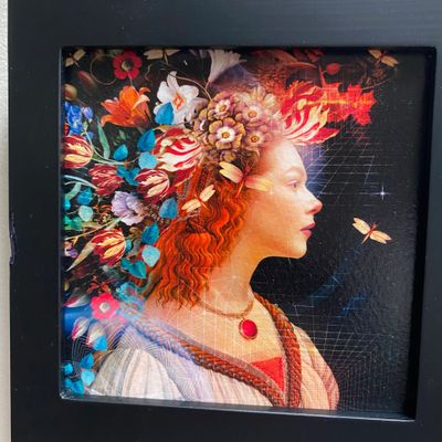 Profile of woman with floral hair and butterfly against dark background.