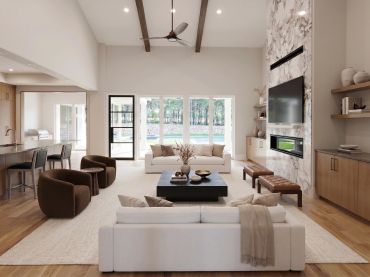 Modern living room with neutral tones and large windows.