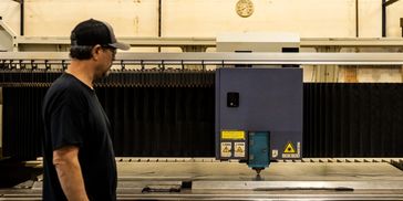 Laser operator observing laser cutting