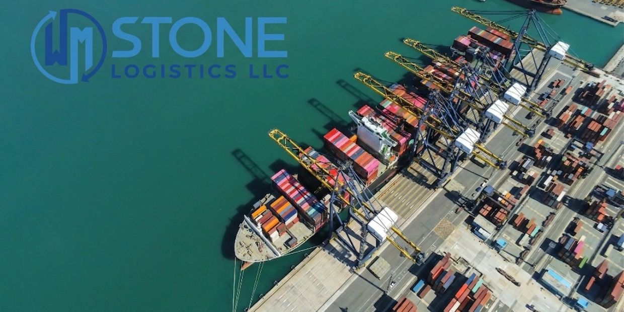 Aerial view of a busy container port with cranes and ships.