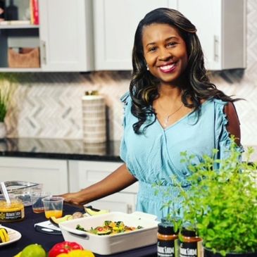 Founder of Cook Pray Slay standing at kitchen counter