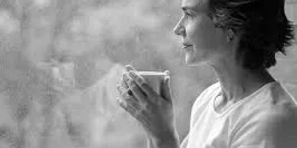 Adult woman drinking coffee