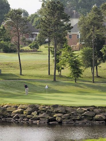 Water & rocks stand guard to the left of the #5 green 