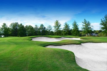 Right side sand traps are not your friend. Play enough loft to clear and reach the green, which slop