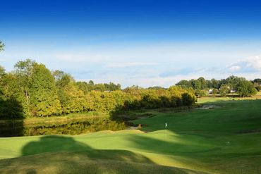 7th is a challenging par 5, severe dogleg right over a lake, that continues along the entire right s