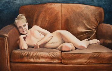 Nude person reclining on a brown leather sofa.