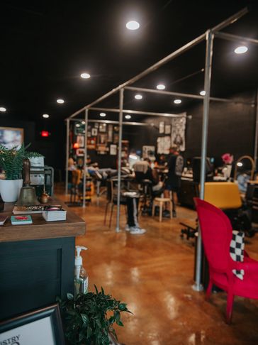 Cozy tattoo studio with clients.