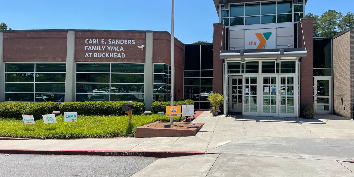 Entrance to Carl E. Sanders Family YMCA at Buckhead on a sunny day.