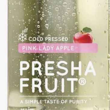 Cold-pressed Pink Lady Apple juice from Presha Fruit with water droplets on the bottle.