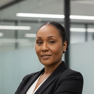 Confident professional woman in business attire with arms crossed.
