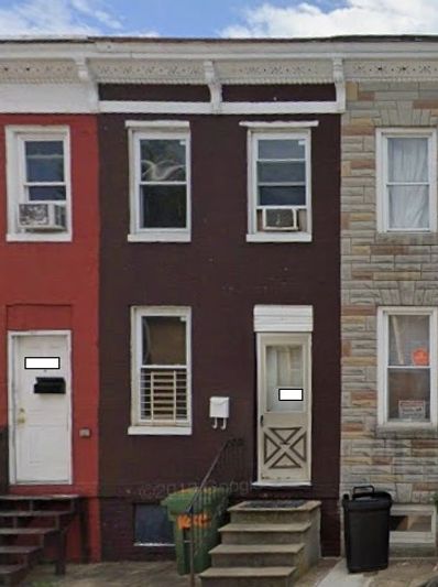 Row of three attached houses with different exterior colors and styles.