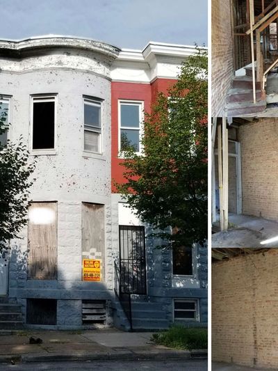 Old, boarded-up house with damaged interior.