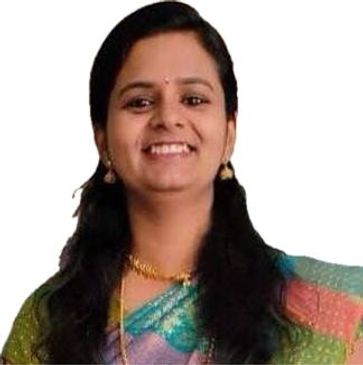 Dr. Deepa Nair, psychiatrist, in colorful sari, smiling warmly.