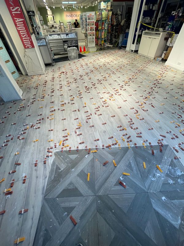 Store floor covered with scattered objects.