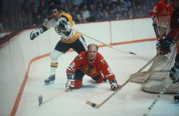 Looks like Bobby Hull was tripped going for puck.