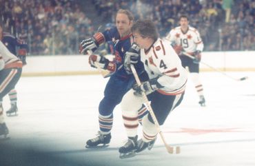 Bobby skating with Bobby Orr in an All Star game.  2 of the best all time skaters. 