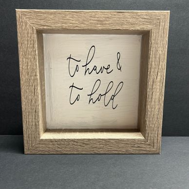 Wooden framed sign with the words 'to have &amp; to hold'.