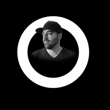Black and white portrait of a man in a cap inside a white circle on a black background.