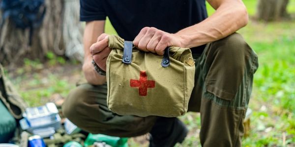 A first aid instructor at TrainSafe-UK explaining a first aid kit