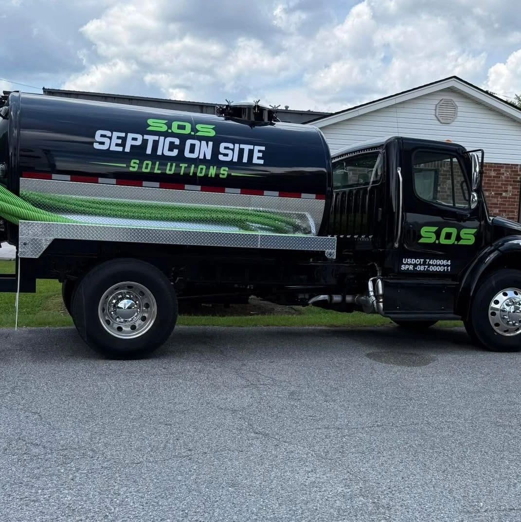 Septic service truck with company branding.