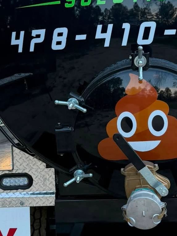 Truck with a smiling poop emoji.