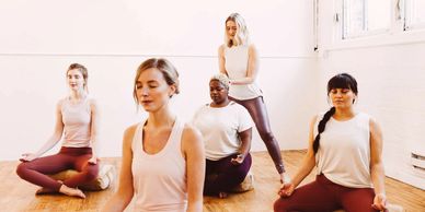 Group of 4 people in a Yomassage class