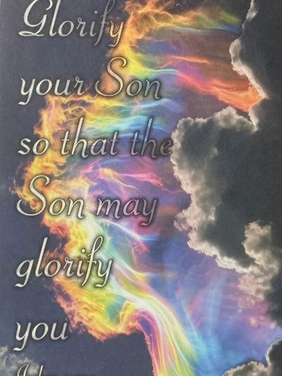 Inspirational quote with a vibrant rainbow and clouds background.