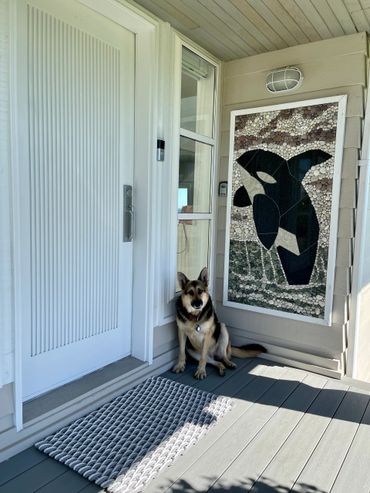 Grey, light grey and white tri-tone doormat at ocean front property.