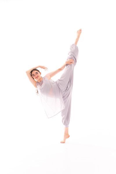 Dancer in flowing costume demonstrating contemporary technique at South Sound Dance studio