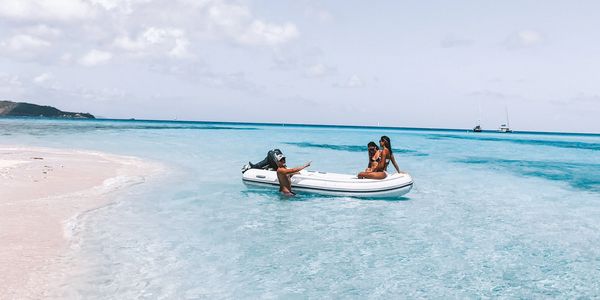 dinghy beached on white sand at Necker Island in BVI 