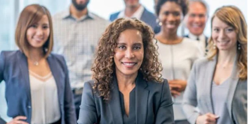Confident businesswoman leading a diverse professional team.
